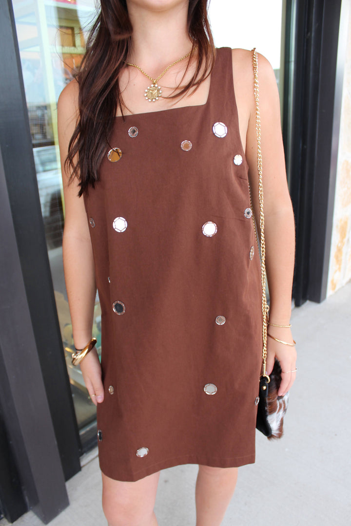 Close up of brown mirror dress