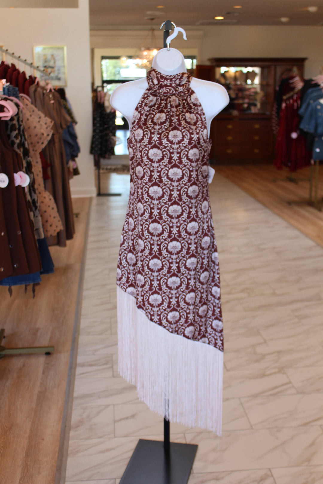 Front of maroon halter pattern fringe dress