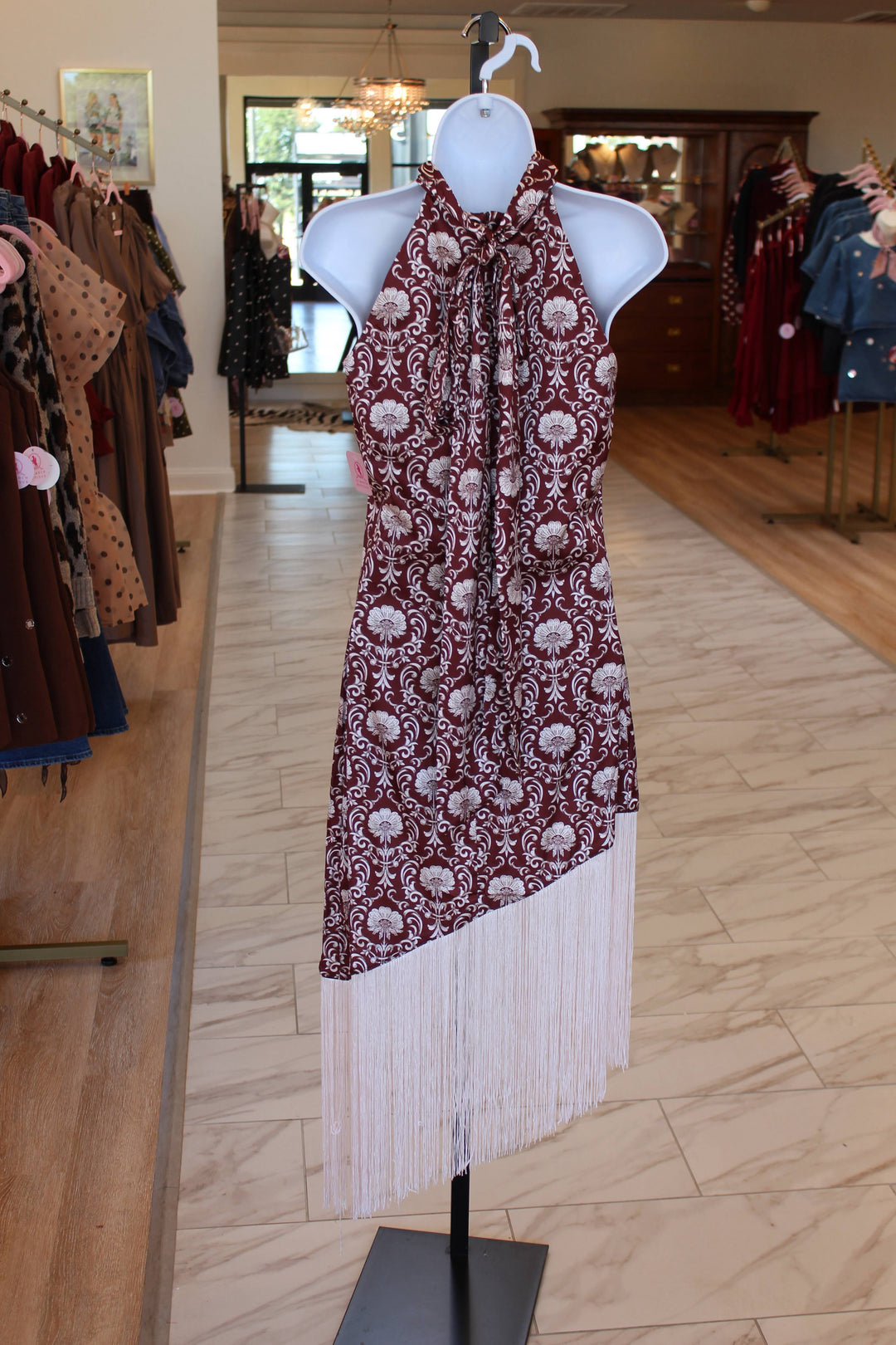 Back of maroon halter pattern fringe dress